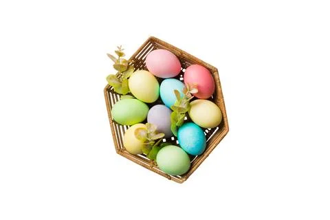 Basket of colorful Easter eggs isolated on white background. Easter basket fi Stock Photos