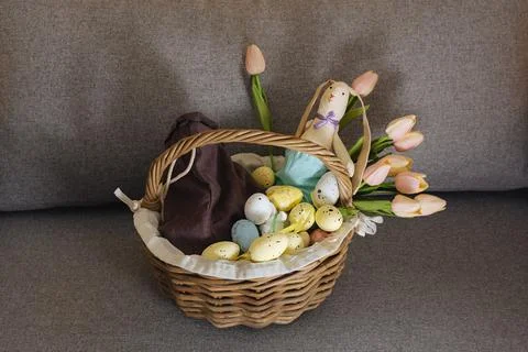 Basket with colorful easter eggs Stock Photos