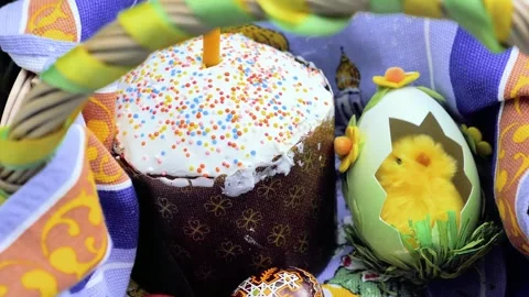 Basket Decorated with Easter Cake, Eggs and Candle on the Nature Stock Footage 274842938