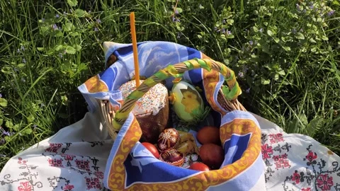 Basket Decorated with Easter Cake, Eggs and Candle on the Ethno Towel Stock Footage 274842943