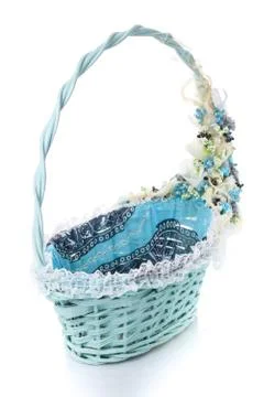 Basket decorated with flowers on white background Stock Photos