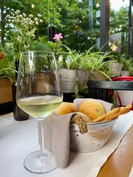 Basket with different types of fresh breads on the table. Stock Photos
