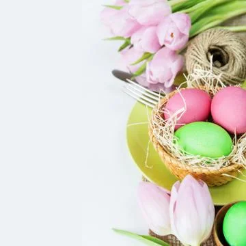 Basket with Easter eggs  and flowers Foto stock