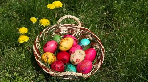 Basket with Easter eggs and yellow dandelions Stock Footage 49051830