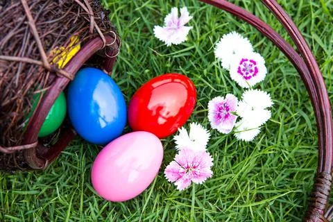 Basket of easter eggs on green grass Stock Photos
