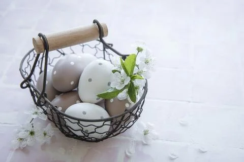 A basket with Easter eggs Stock Photos