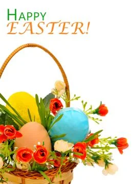 Basket with easter eggs, roses, flowers and green grass Stock Photos
