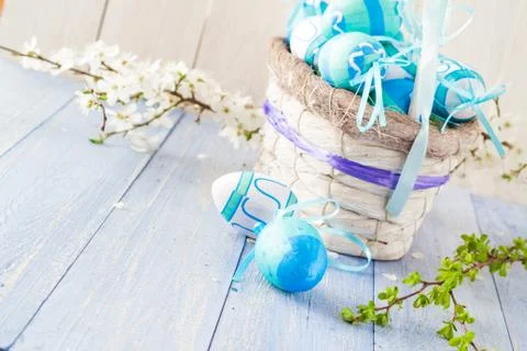 Basket easter eggs spring branches Stock Photos