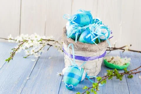 Basket Easter eggs spring branches Stock-Fotos