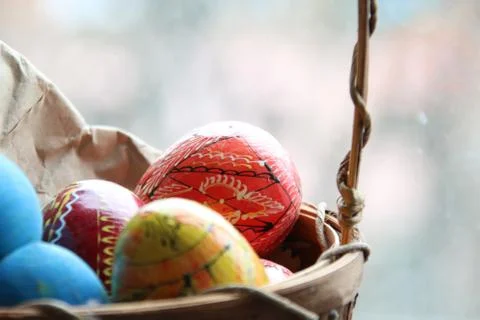 Basket with easter eggs. Spring easter background with space for text. Stock Photos