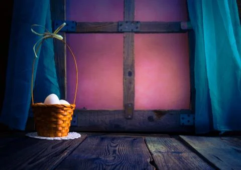 Basket Easter eggs table window Stock Photos