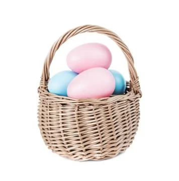 Basket with Easter eggs on white background Foto stock