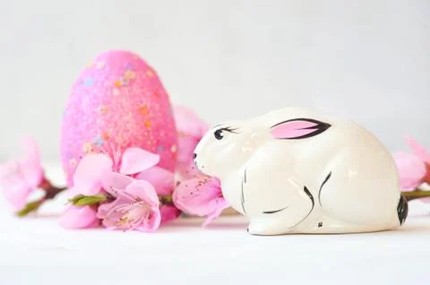 Basket with easter eggs on white background Stock Photos