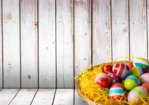 Basket with Easter eggs with wood background Stock Illustration