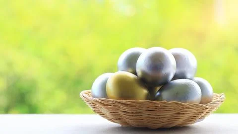 Basket of eggs for Easter on a natural blur background Stock Photos