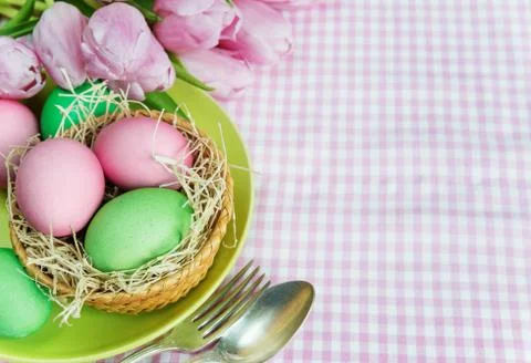 Basket with flowers and Easter eggs Stock Photos