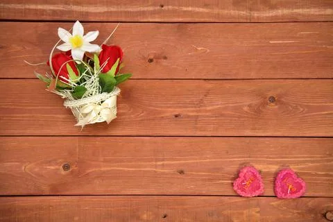 A basket of flowers. paper elements in the shape of a heart, on a wooden 库存照片