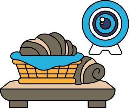 A basket of food is on a table next to a camera Ilustração Stock