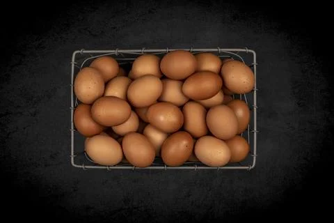 Basket of fresh brown eggs Stock Photos
