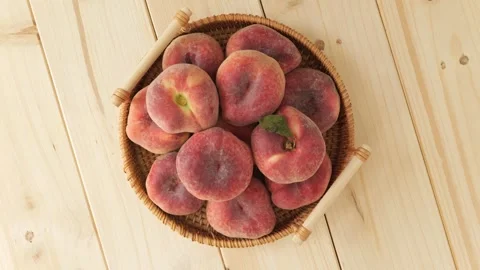 Basket of fresh peaches rotating Stock Footage 338312321