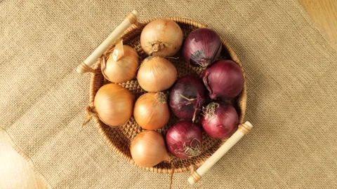 Basket of fresh red and yellow onions rotating Stock-Footage 340160053