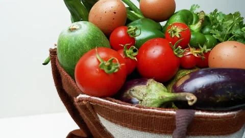 Basket of Fresh Vegetables and Eggs footage, A basket filled with fresh veg.. Stockbeeldmateriaal 305045870