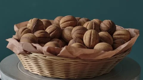 A basket full of cookies in the form of nutshell rotating close up Видео 133266147