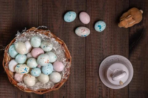 Basket full of Easter eggs and bell Stock Photos