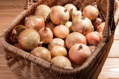 Basket full of onions. Stock Photos