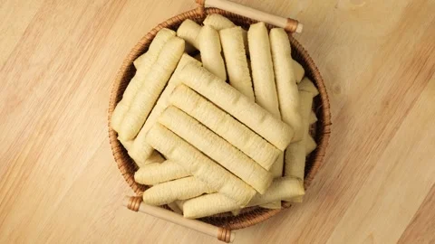 Basket full of wafer roll cookies rotating Stock Footage 341822723