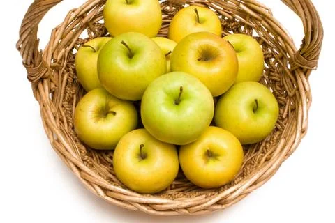 Basket with golden apples Stock Photos