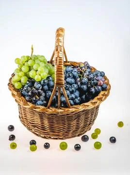 Basket with grapes Stock Photos