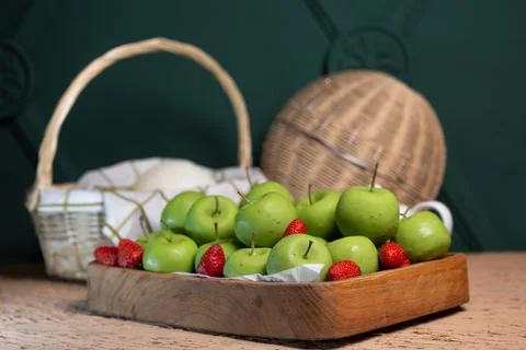 Basket with green apples on the table Stock Photos