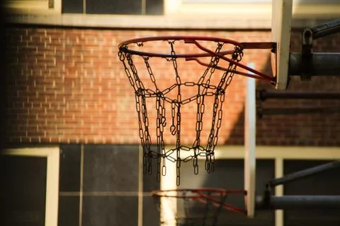 Basket hoops with chains in a school yard in New York Stock Photos