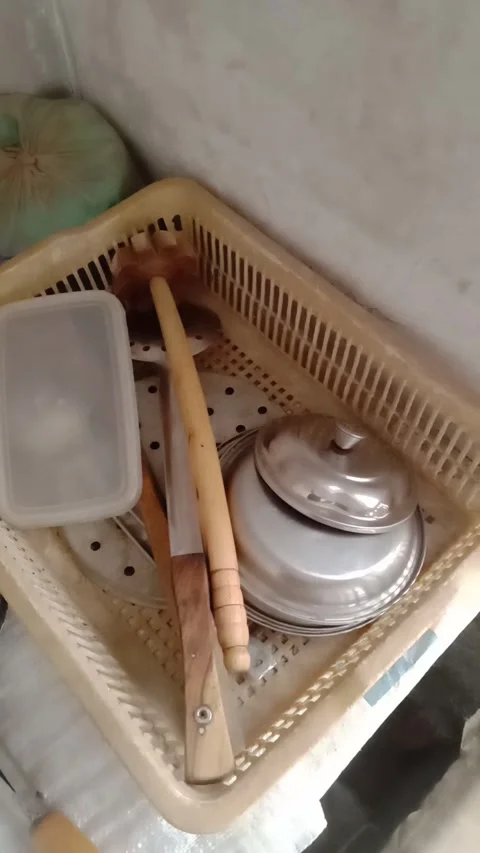 A basket in the kitchen filled with different utensils placed together. Stock Footage 331899853