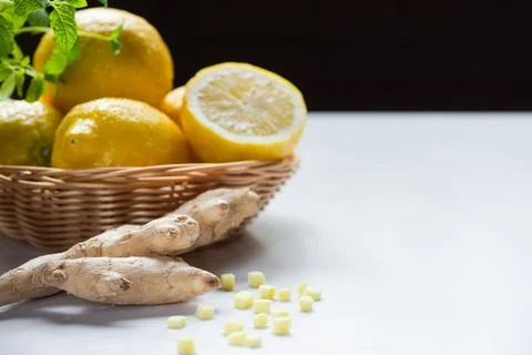 Basket lemons ginger root white Stock Photos