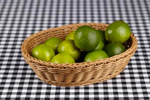 Basket of limes Stock Photos