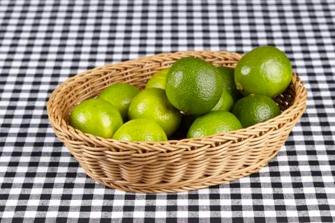 Basket of limes Stock Photos