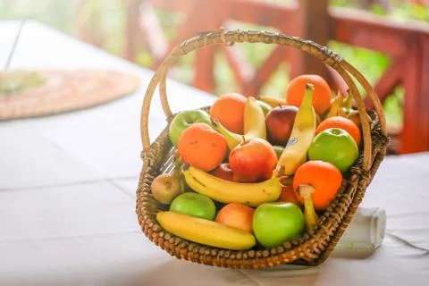 A basket with lot of different fruit on the table. Wedding table decoration i Stock Photos