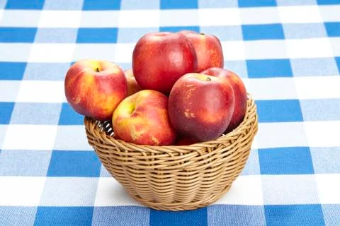 Basket of nectarines Stock Photos