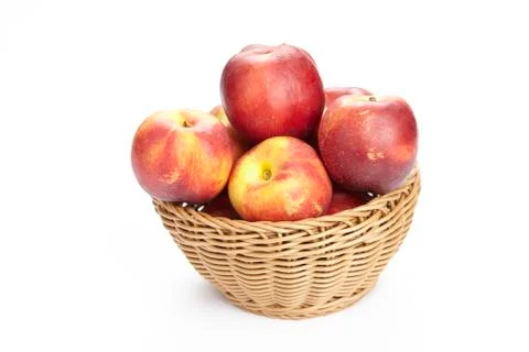 Basket of nectarines Stock Photos