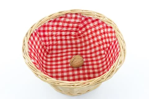 Basket with one single walnut 스톡 사진