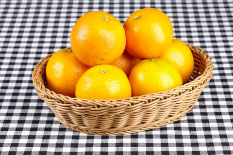 Basket of oranges Stock Photos