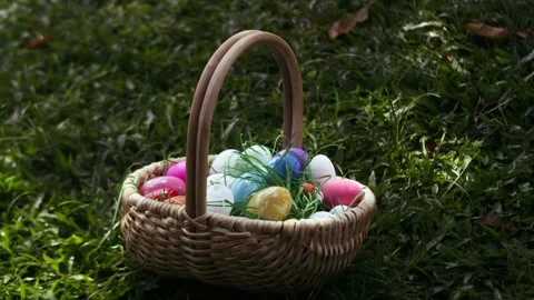 Basket with painted easter eggs, easter egg hunt game theme. Colored eggs in Stock Footage 304742975