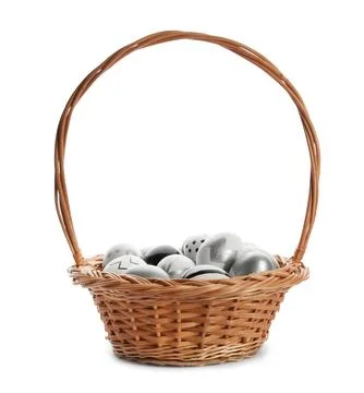 Basket with painted Easter eggs on white background Stock Photos
