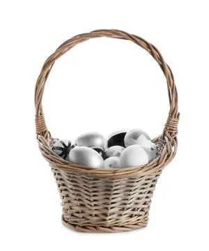 Basket with painted Easter eggs on white background Stock Photos