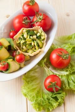 Basket of parmesan with veggies Stock Photos