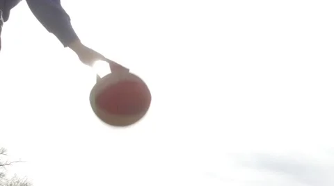 Basket Player in slow motion against sun. Silhouette of a boy hand Bounce ball Stock Footage 60239705