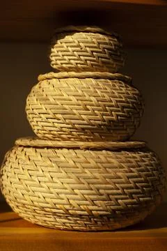 Basket for small things. Object in interior. Braided box is rounded in shape. Stock Photos