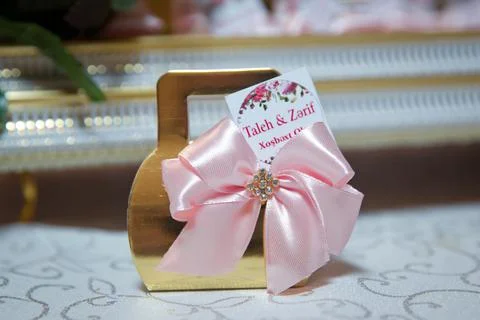 Basket with sweets stands on the table .The handle of the engagement basket . Stock Photos